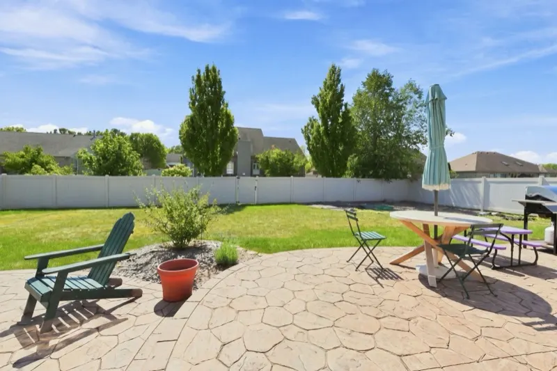 Patio and privacy-fenced yard